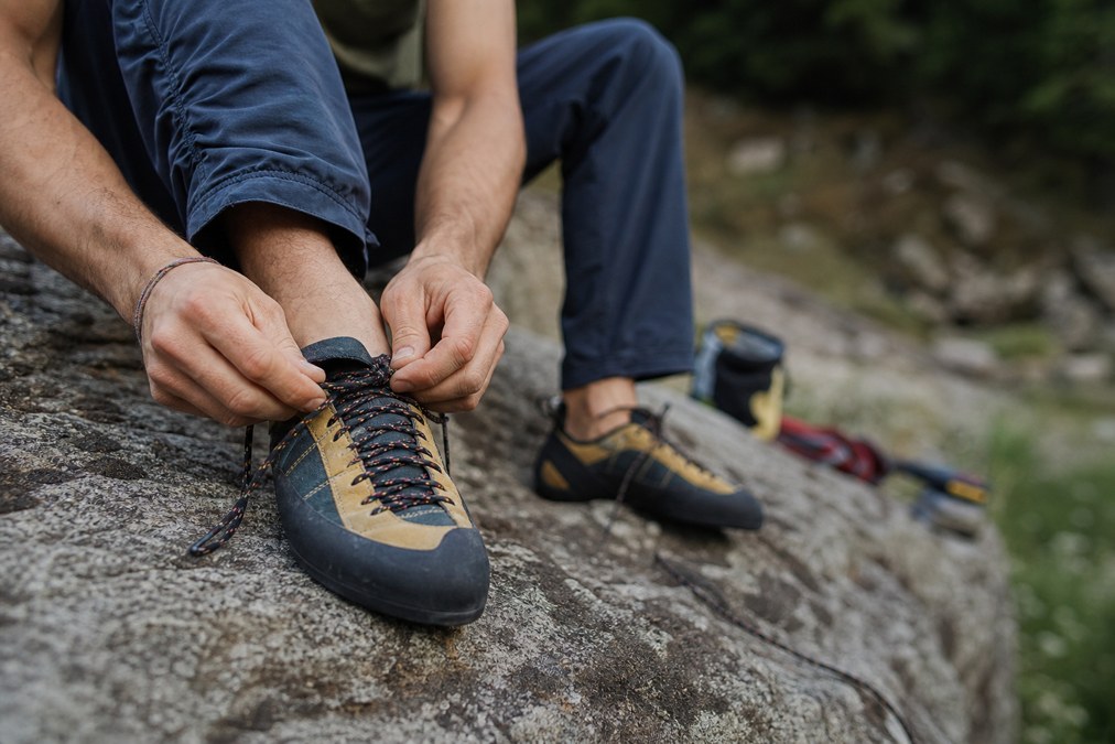 Rock climbing shoes on granite boulders at an outdoor crag