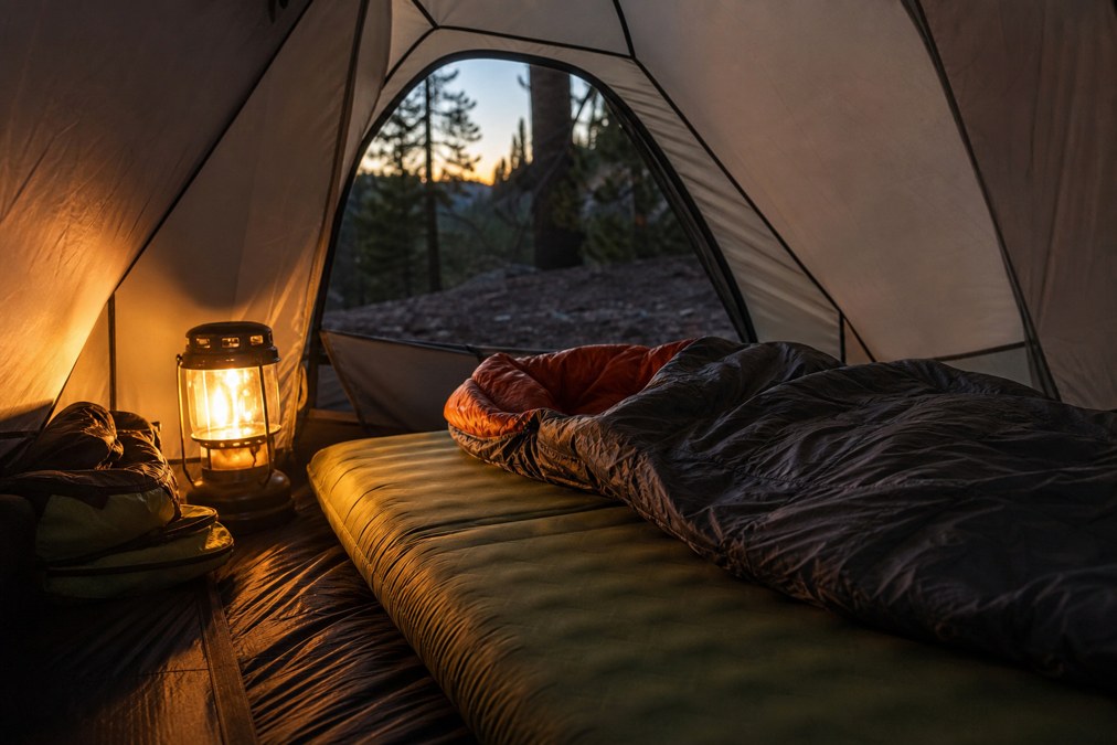 Self-inflating camping mattress inside a backpacking tent