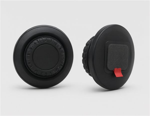 AI-generated illustration of round drop-in helmet speaker discs with glove-friendly dials matching the OutdoorMaster MZ04 style