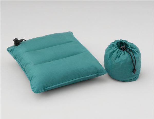 AI-generated illustration of a tiny ultralight inflatable camping pillow matching the Sea to Summit Aeros Ultralight style