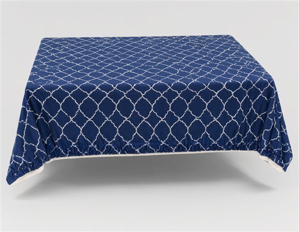 AI-generated illustration of an elastic-edge fitted table cover with Moroccan pattern matching the Smiry style